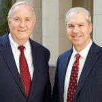 Portrait of Koch and Brim smiling in black suits - Las Vegas personal injury attorneys