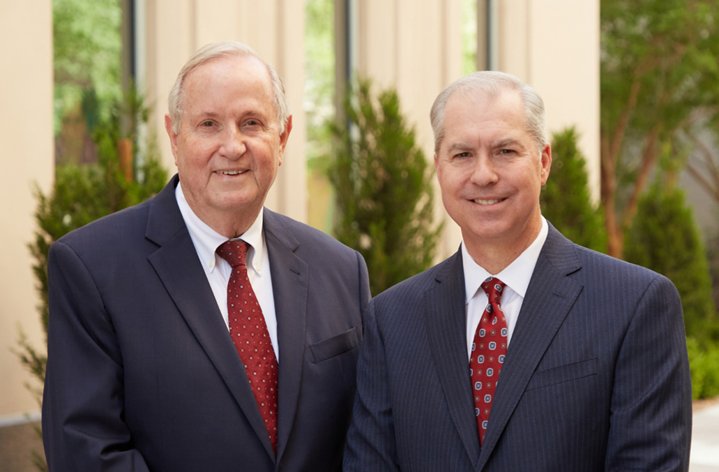 Portrait of Koch and Brim smiling in black suits - Las Vegas personal injury lawyers