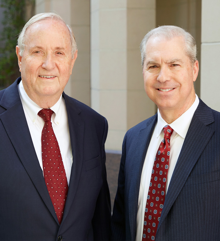 Portrait of Koch and Brim smiling in black suits - Las Vegas personal injury lawyers