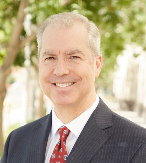 Portrait of Attorney Brim smiling in a black suit - Las Vegas personal injury attorneys